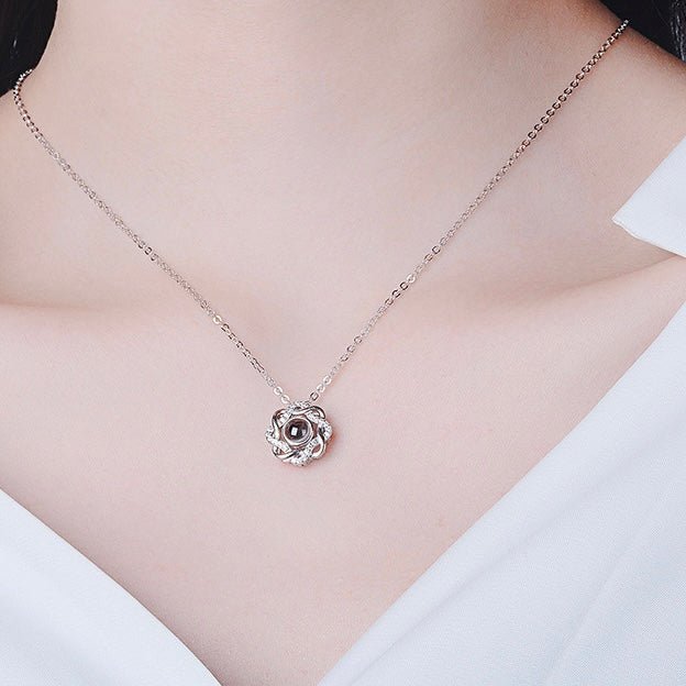 Customodish's Intertwined Love Projection Necklace is a vintage style one. It can be personalized with one's picture inside the pendant.