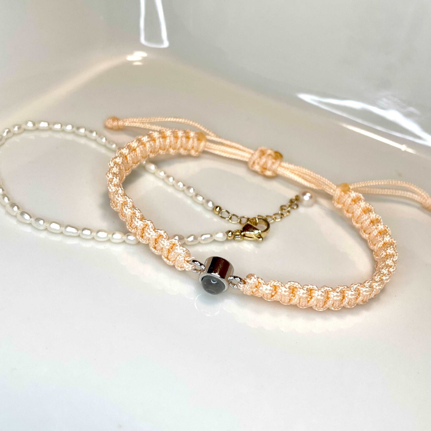 This is a lovely photo projection necklace in light orange.