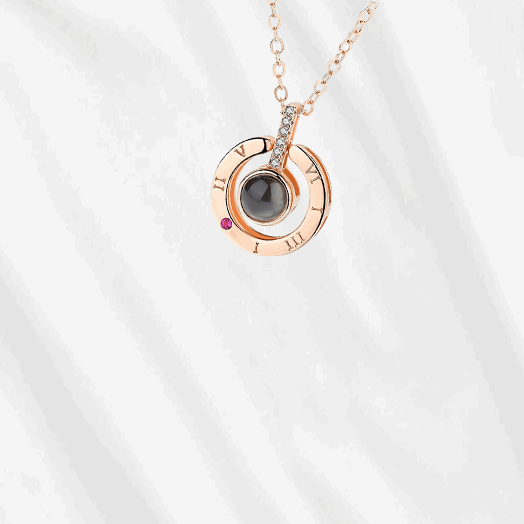 The personalized projection necklace hides your customized picture inside, and can project it onto a surface.