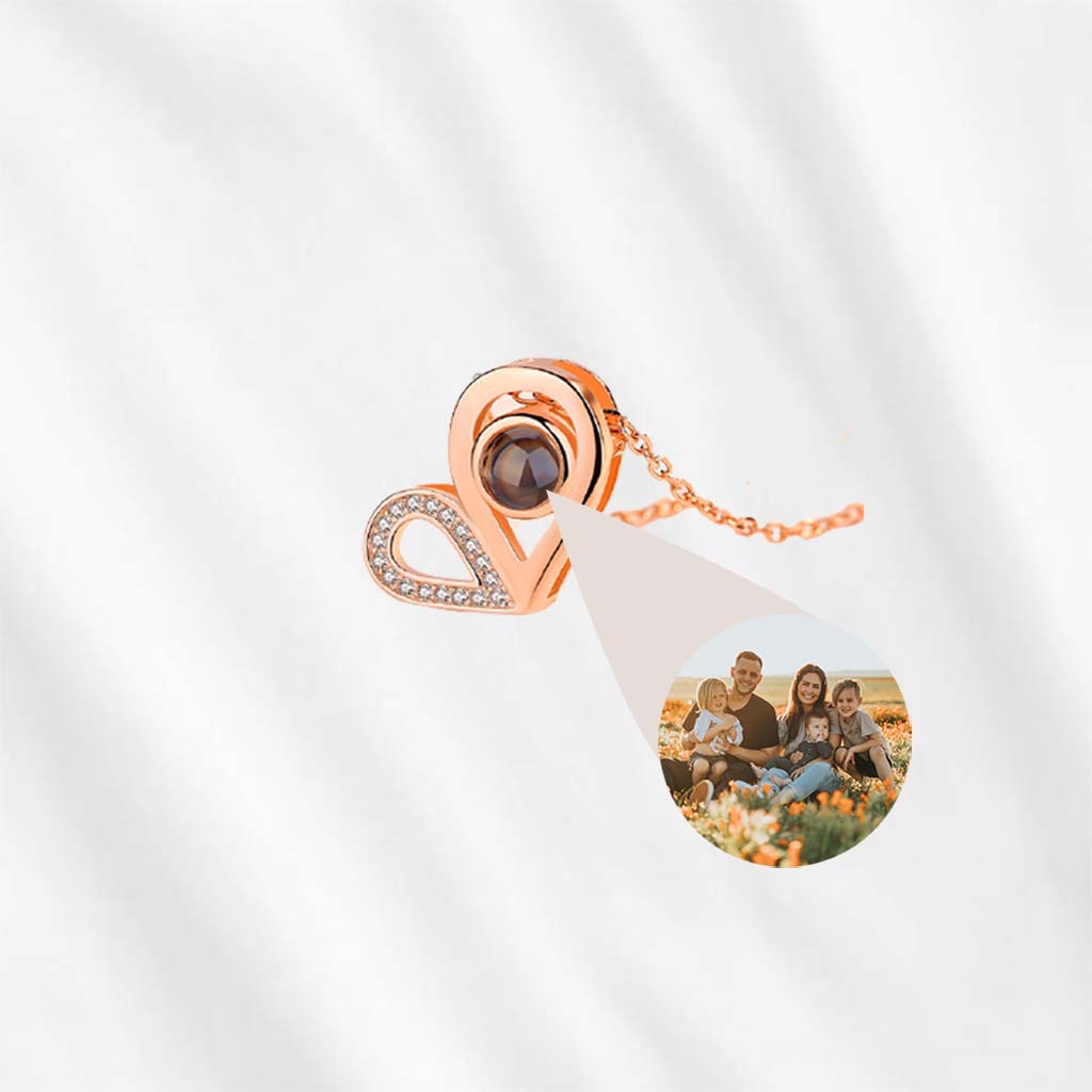 This heart projection necklace is probably the best gift for her, with customized picture inside the central gem.