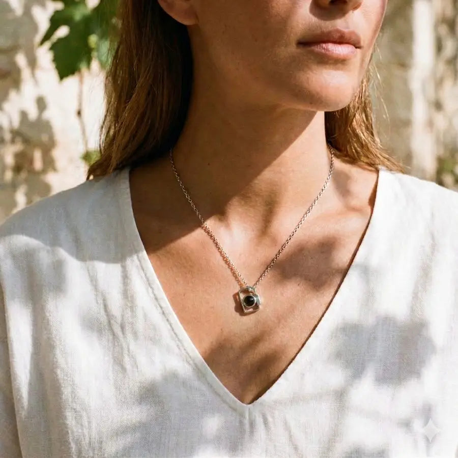 Woman wearing a camera pendant with projection