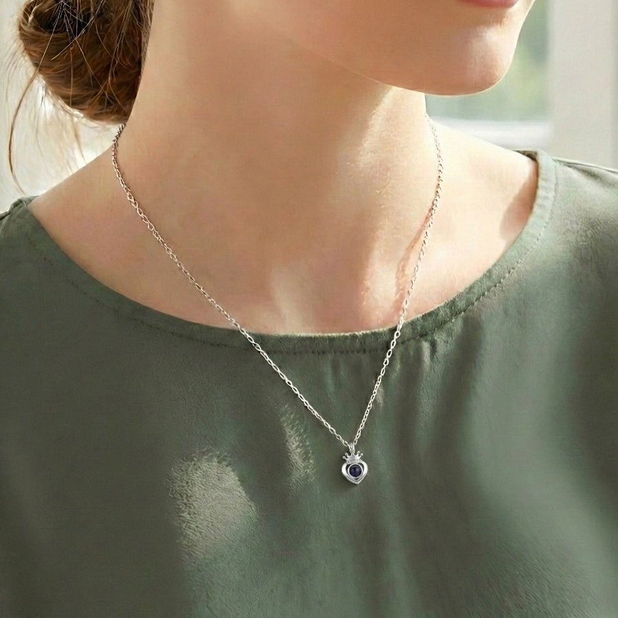 woman wearing Crown Heart Necklace with mother's photo inside