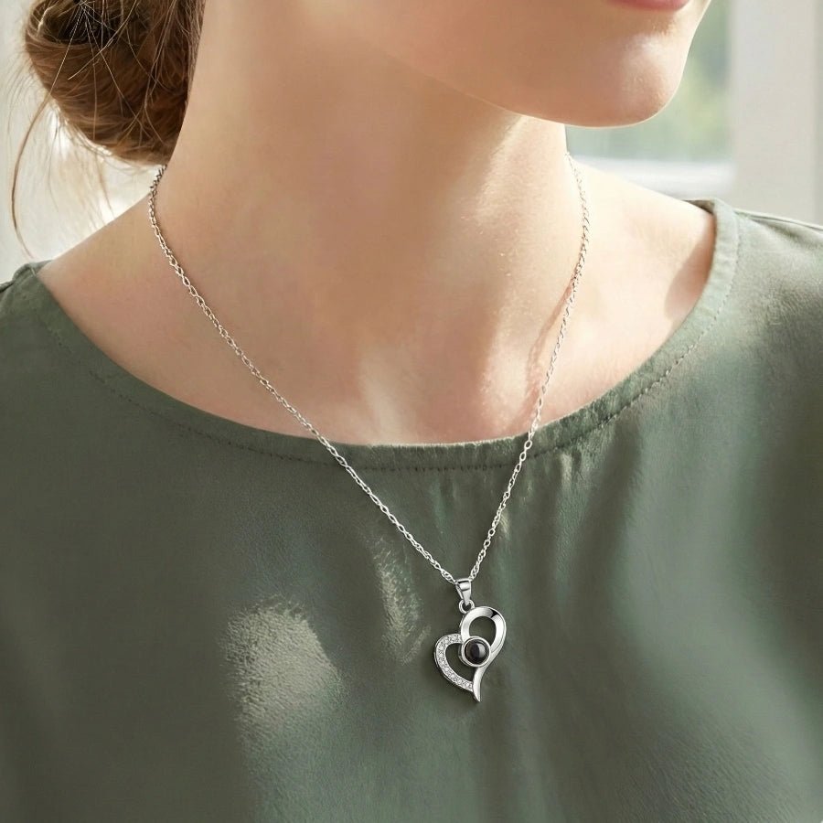 woman wearing a heart photo projection necklace