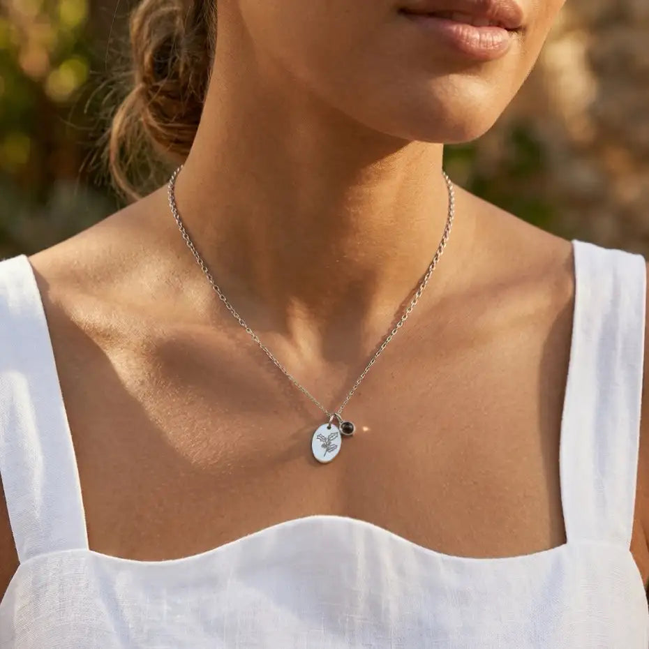woman wearing a Personalized Birth Flower Projection Necklace