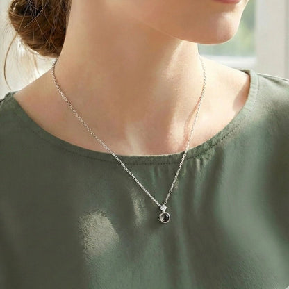 Woman wearing a Dainty Necklace with custom pet Image Inside