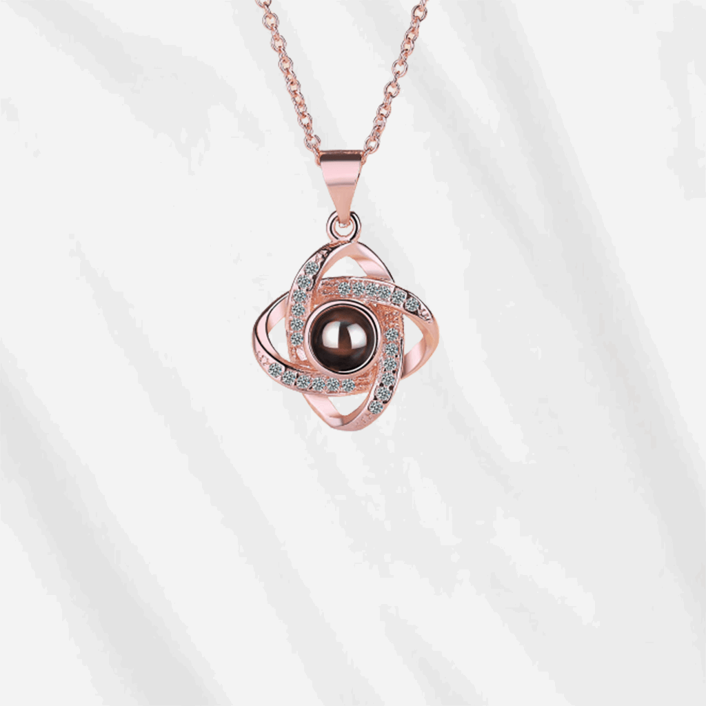 To unlock the magic of Customodish's photo projection necklace, you can look into the pendant, or shed a light onto the back of the central stone.