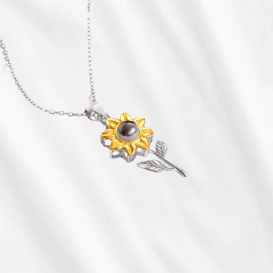 This sunflower projection necklace is a necklace with tiny picture inside. Made from sterling silver by Customodish.