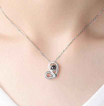 woman wearing a Heart Photo Projection Charm with custom picture inside