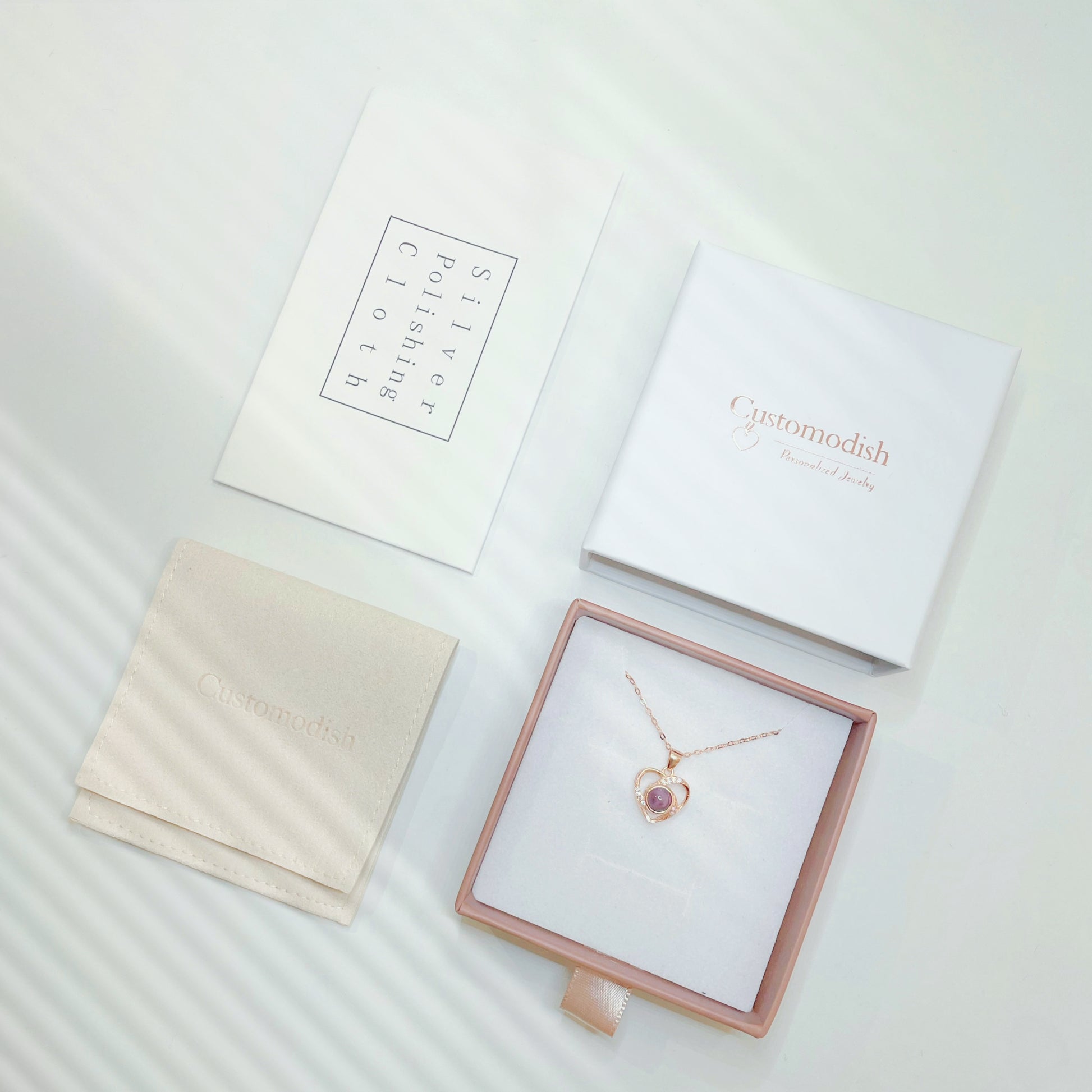 All photo projection necklace at Customodish will come in a beautiful jewelry box with a jewelry pouch and a silver polishing cloth.