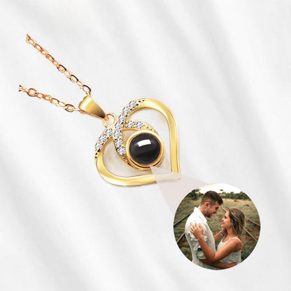 Gold heart projection necklace that holds your custom picture inside