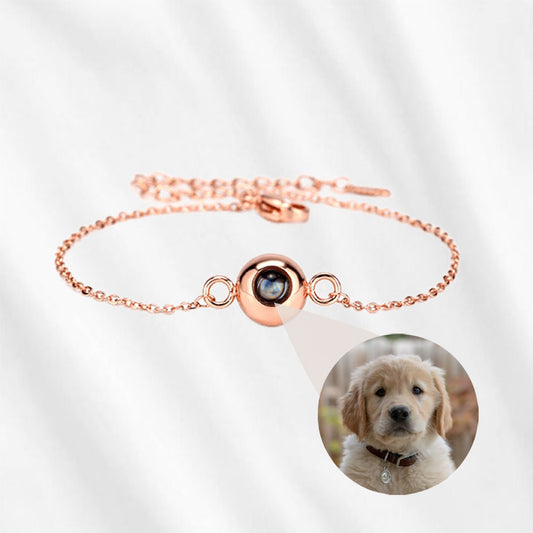 A circle photo projection bracelet in rose gold.