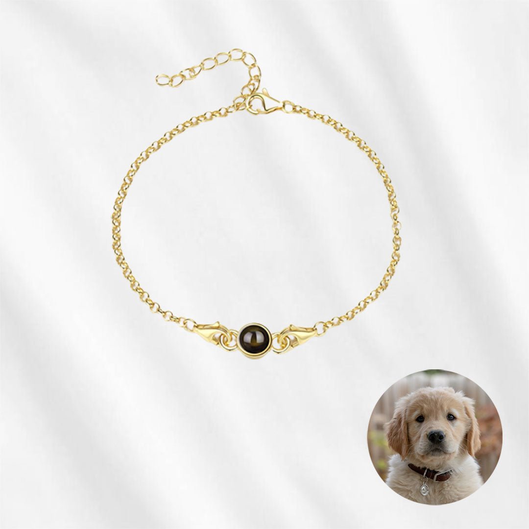 This bracelet with photo inside is made of sterling silver and plated in gold.