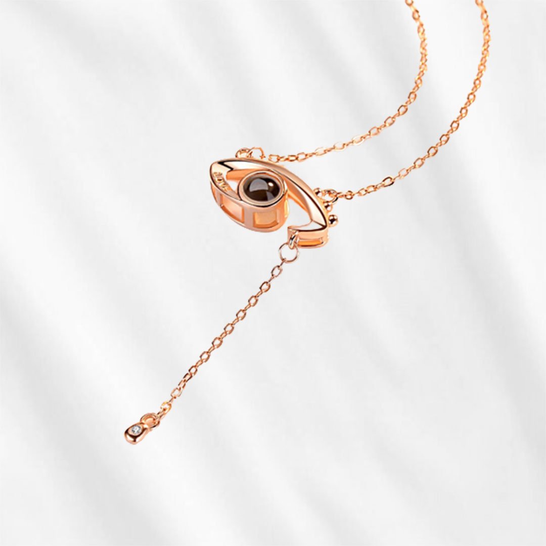 The eye shape projection necklace has silver and rose gold colors.
