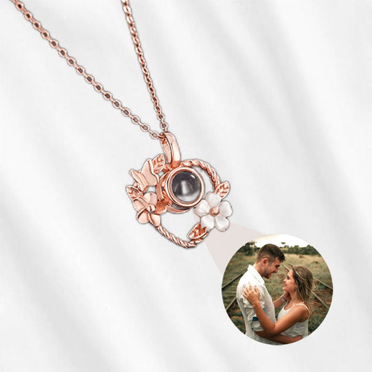 Photo projection necklace with butterfly and flower