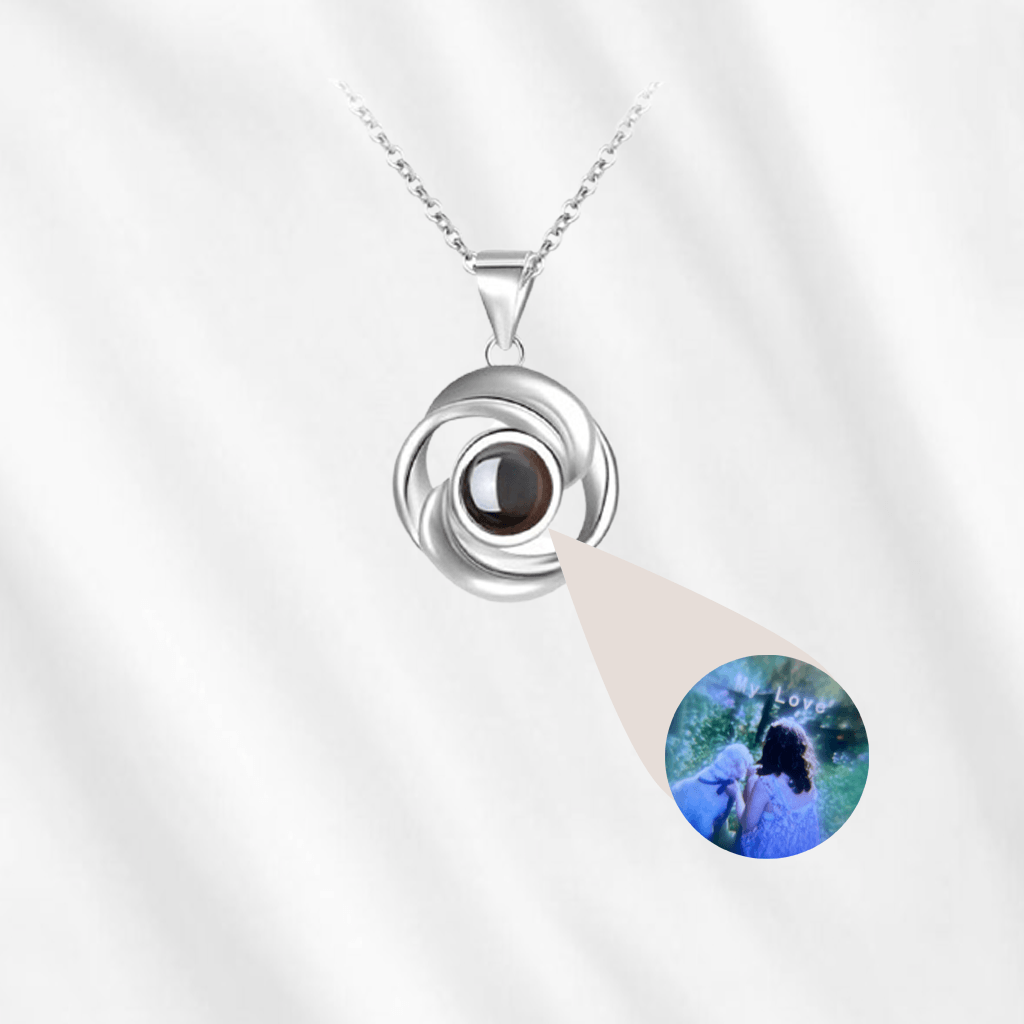 Customodish's rosebud photo projection necklace is elegant and beautiful. It hides your picture in the central stone and when illuminated it projects the picture onto the wall.