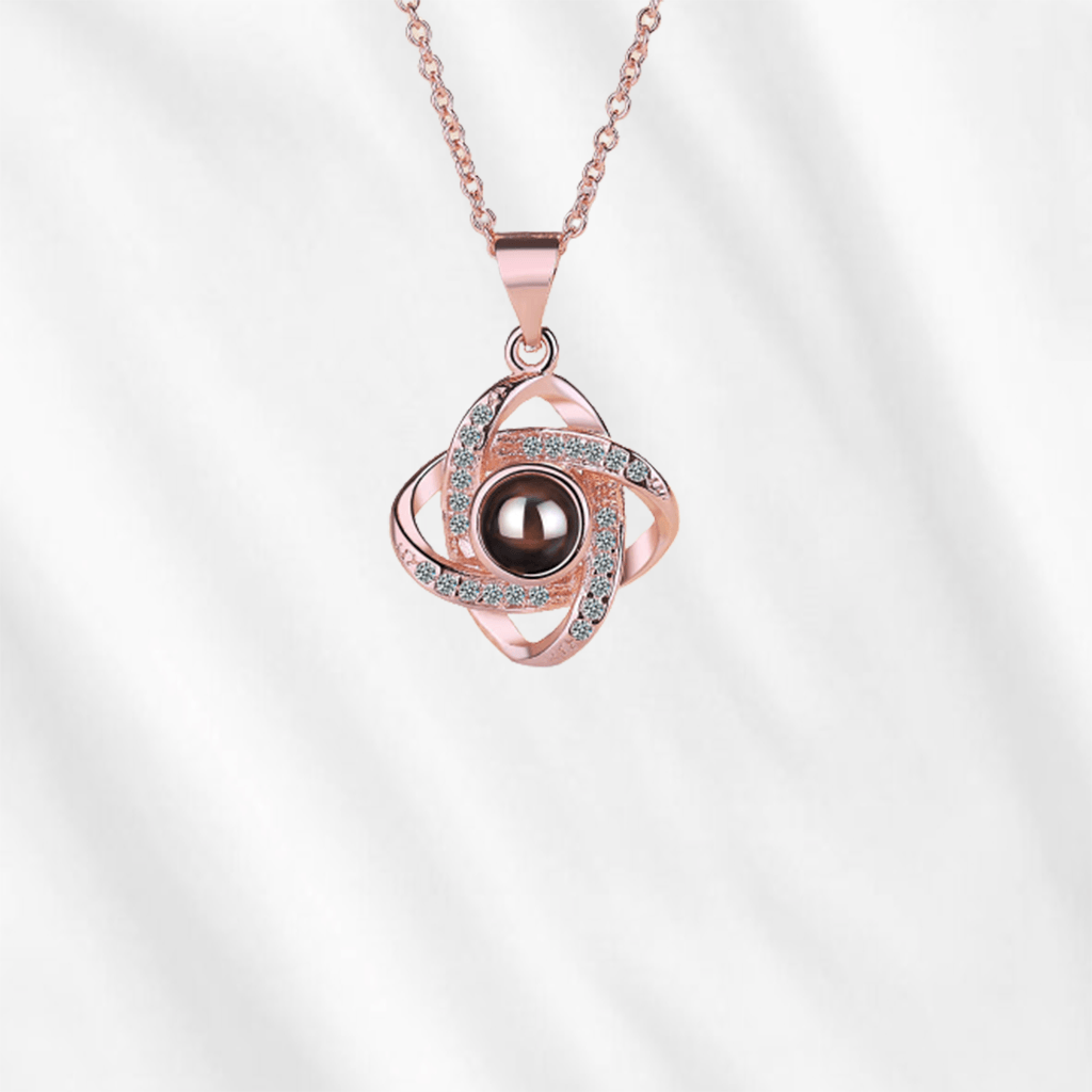 To unlock the magic of Customodish's photo projection necklace, you can look into the pendant, or shed a light onto the back of the central stone.