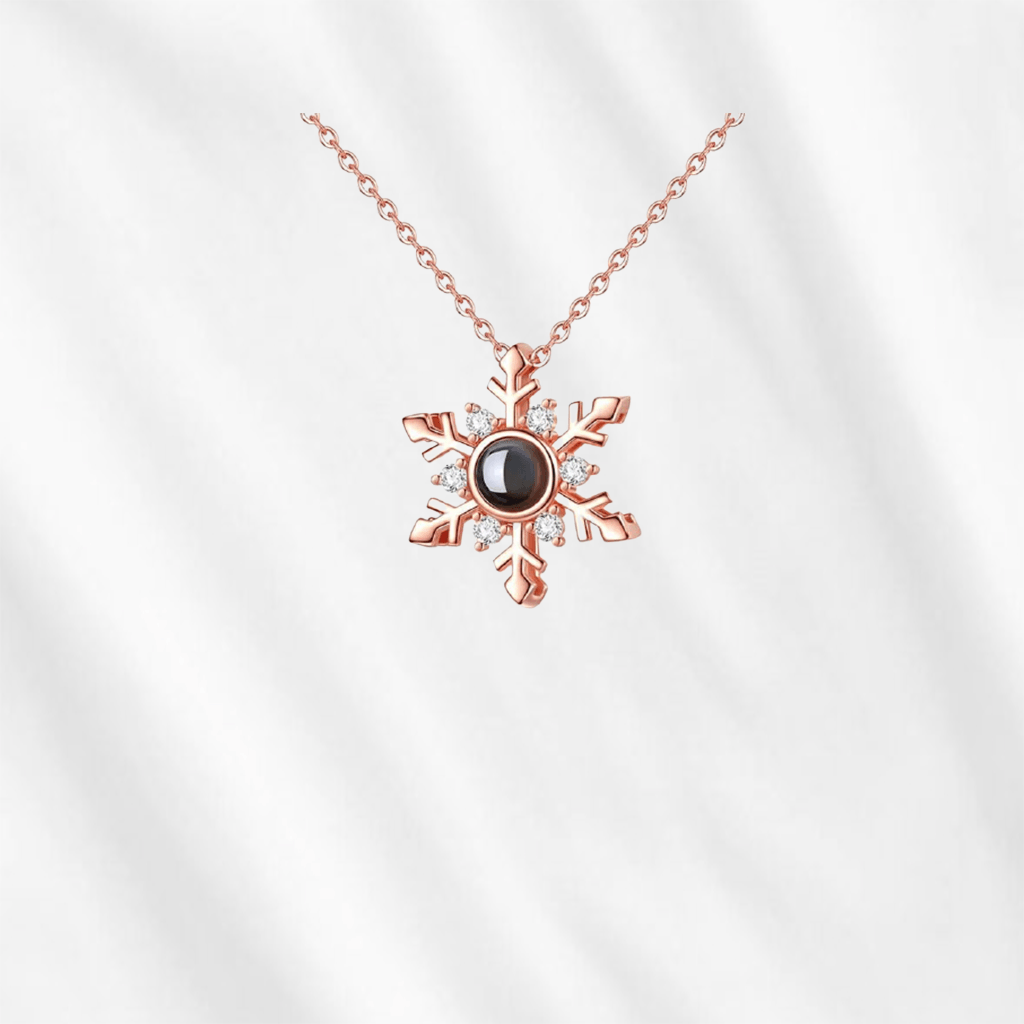 The photo projection necklace hides the picture inside its central stone. A good keepsake as well as perfect gift for those you love. Made with 925 sterling silver and plated in 14k gold. 