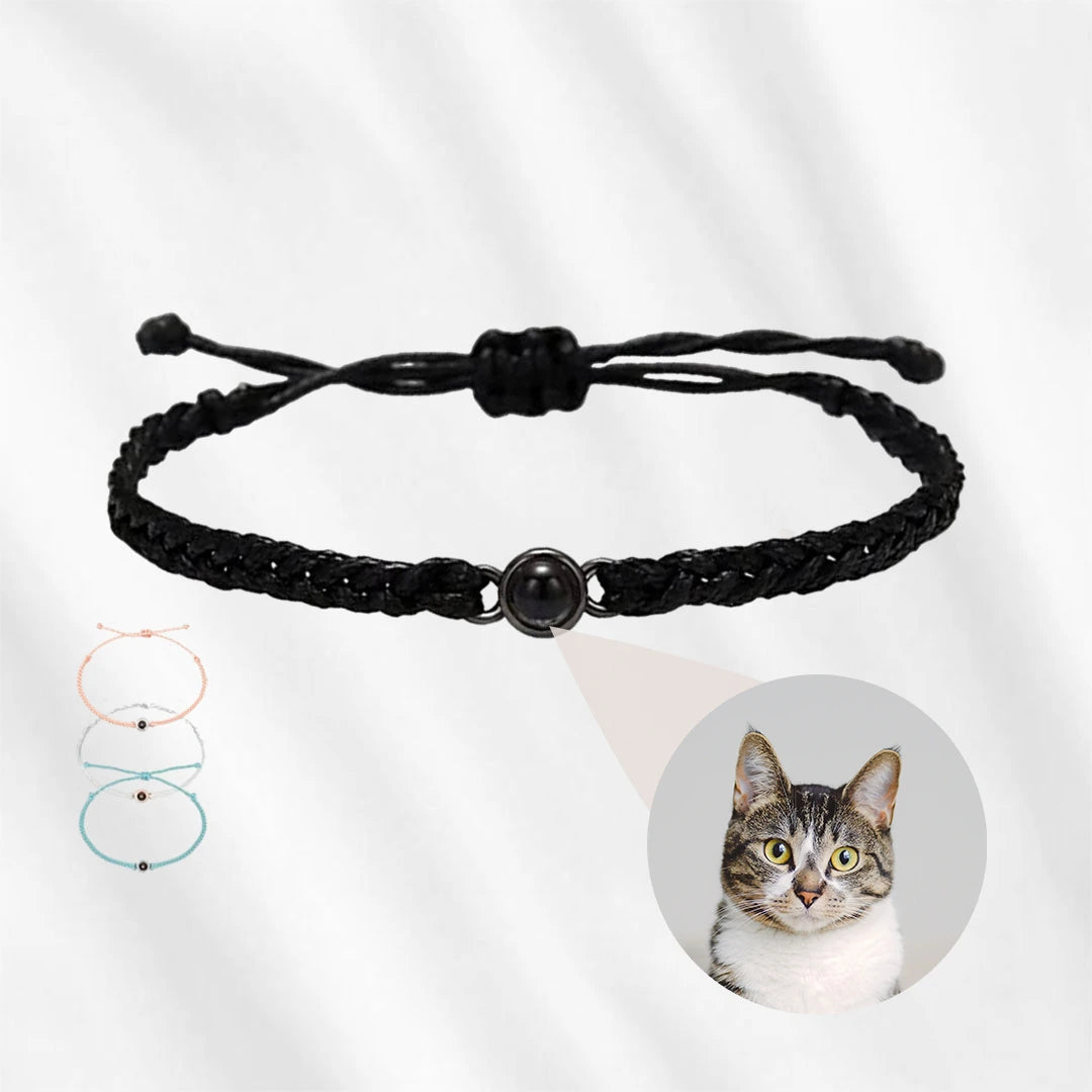 Black braided projection bracelet featuring a cat